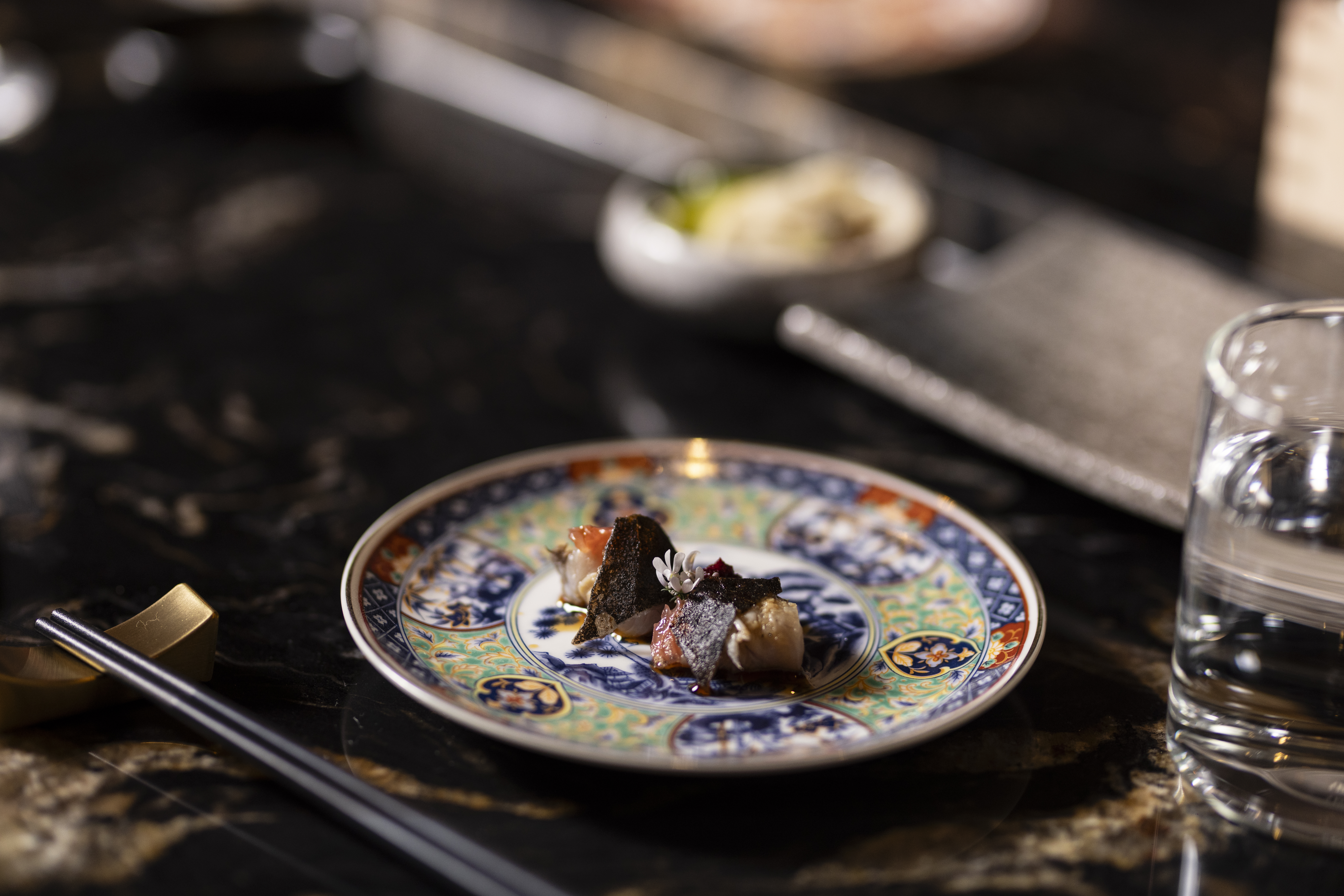 Omakase dish on decorative plate